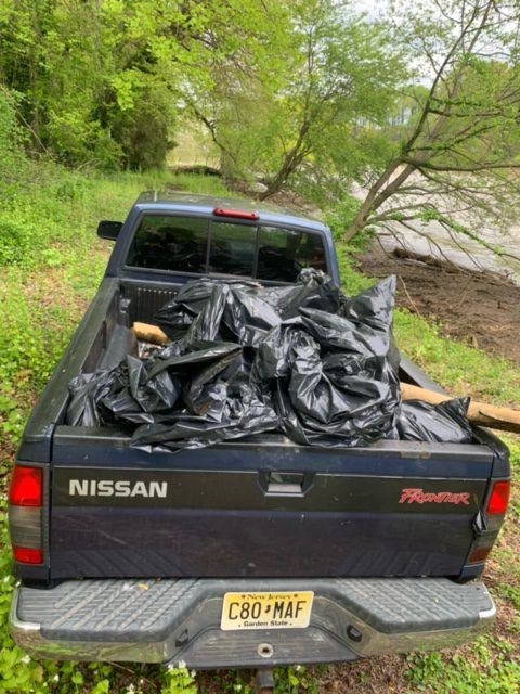 Black Truck Full of Trash Bags